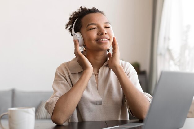 Woman listening to music medium shot