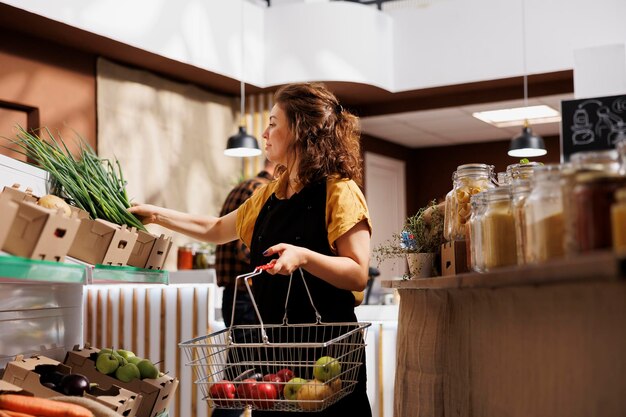 Woman in local eco store buys food