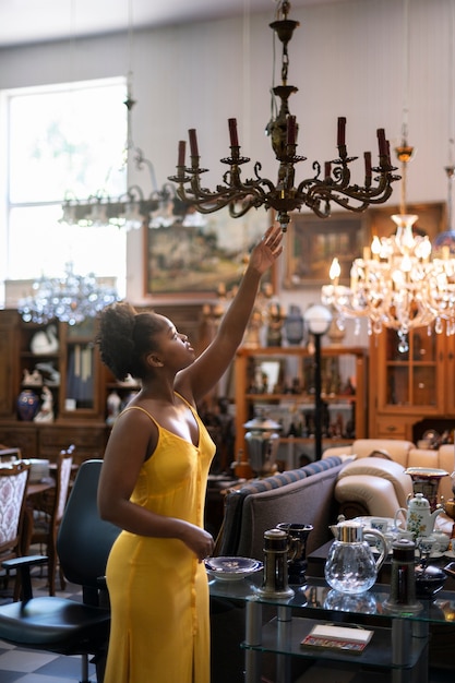 Woman looking at chandelier side view