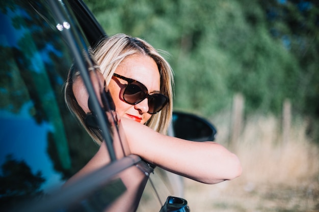 Woman looking out of car window