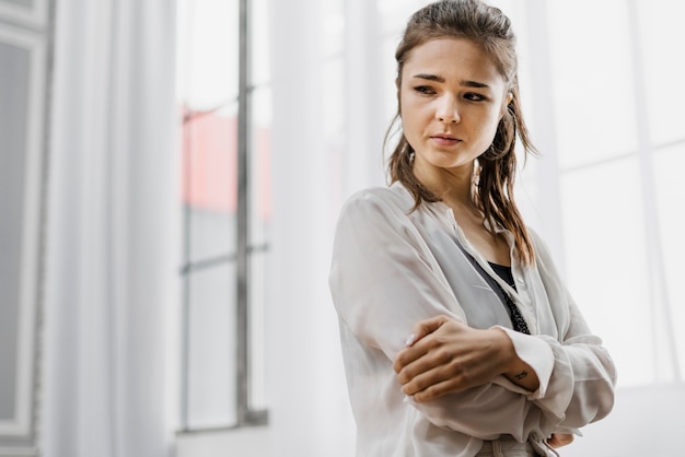 Free Photo woman looking sad as she worked from home too much