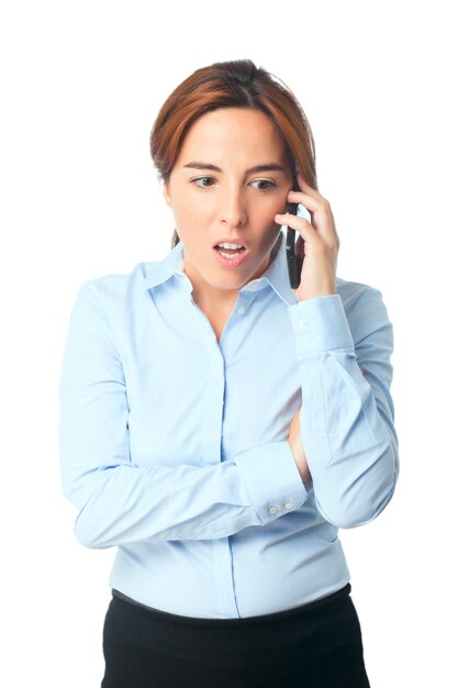 Woman looking surprised with her smartphone