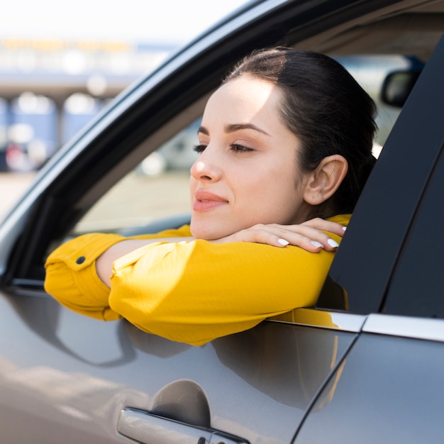 Woman looking through the car window