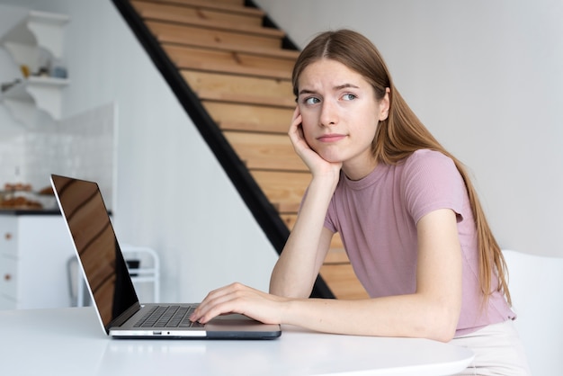 Free photo woman looking weird at something next to her