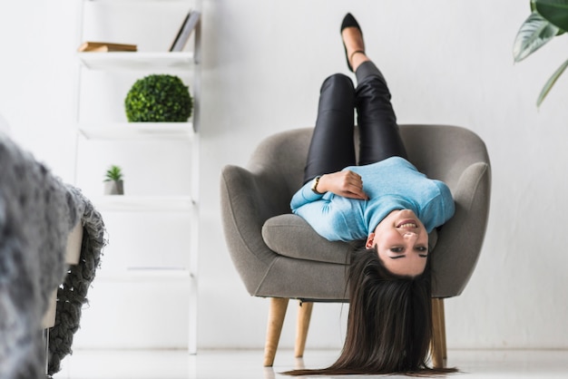 Free photo woman lying in armchair