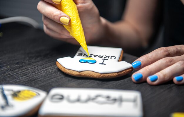 A woman makes patriotic gingerbread in support of ukraine