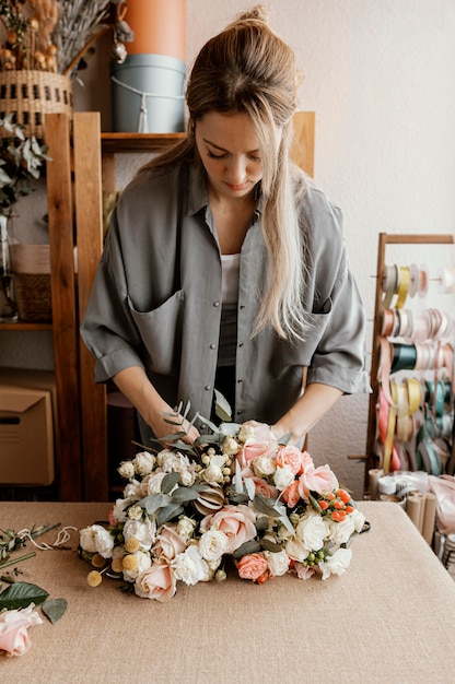 Woman making a beautiful floral arrangement