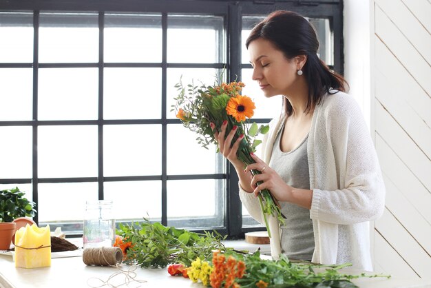 Woman making a beautiful floral bouquet