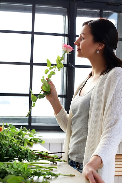 Woman making a beautiful floral bouquet