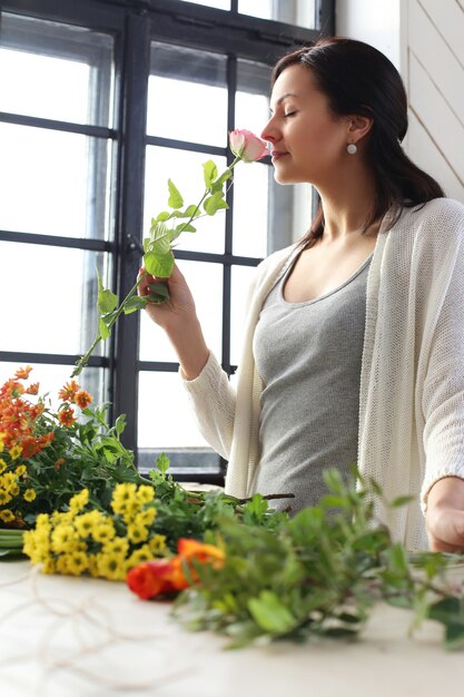 Woman making a beautiful floral bouquet