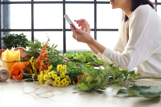 Woman making a beautiful floral bouquet