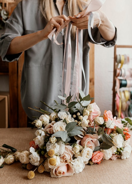 Woman making a beautiful floral bouquet