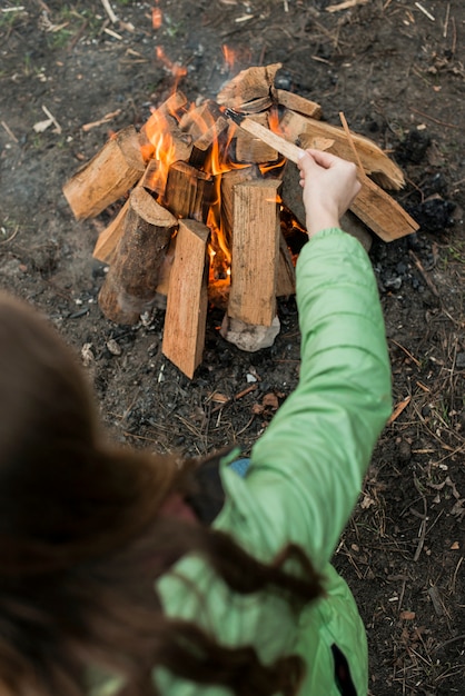 Free Photo woman making bonfire