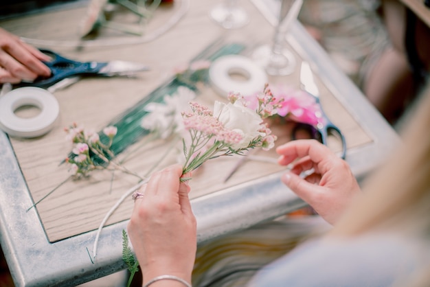 Free Photo woman making a decoration with flowers