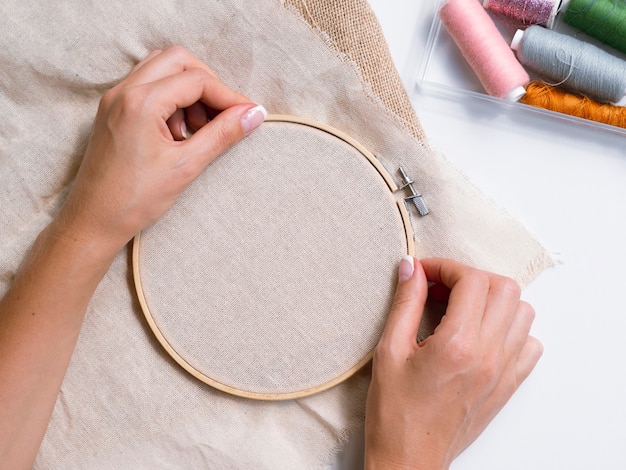 Free Photo woman making decorations with wood rings and fabric