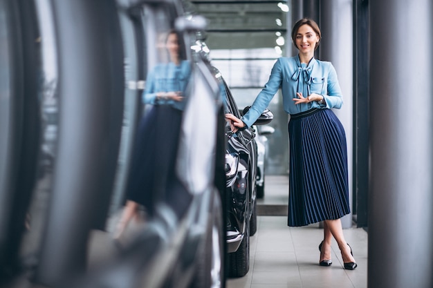 Free Photo woman making a desicion to buy a car