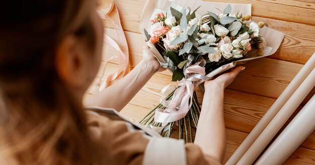 Woman making a floral arrangement