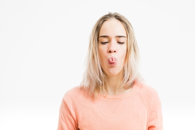 Free photo woman making gesture with tongue