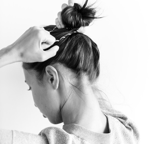 Free photo woman making hair bun