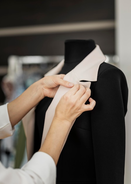 Free photo woman making jacket close up