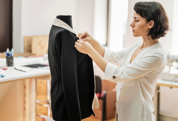 Free photo woman making jacket