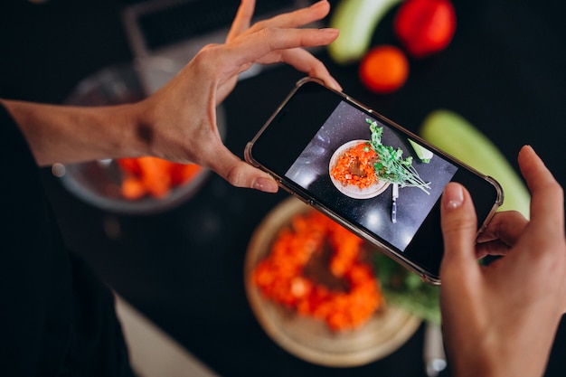 Free photo woman making photo of a meal on her phone