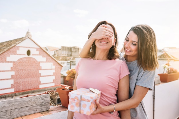 Free photo woman making surprise for woman on street