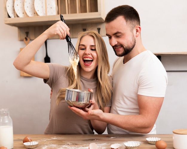 Woman and man cooking toghether