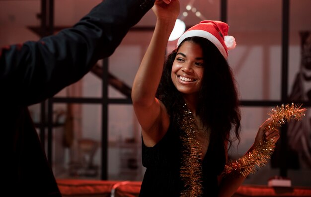 Woman and man dancing at new year's eve party