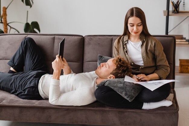 Woman and man making plans to renovate the house together