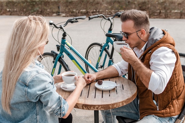 Woman and man talking next to bikes