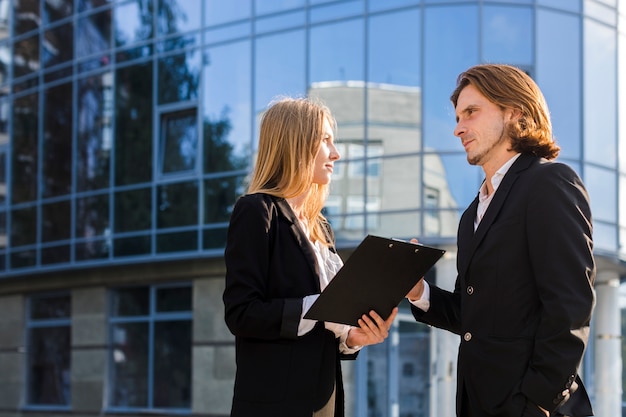 Free Photo woman and man talking medium shot