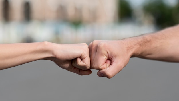 Woman and man touching fists