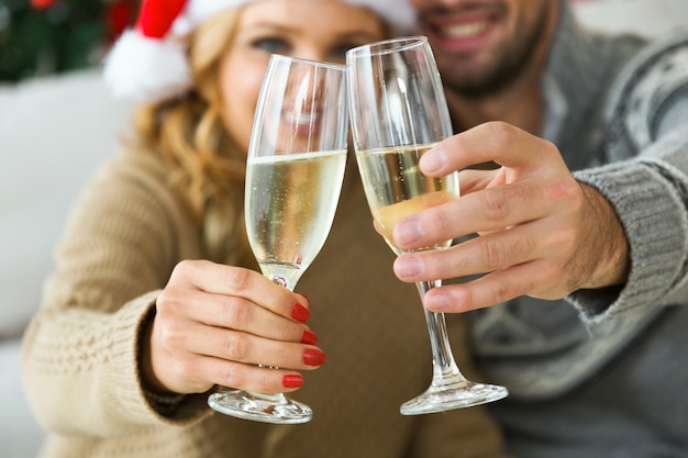 Woman and man with champagne glasses smiling