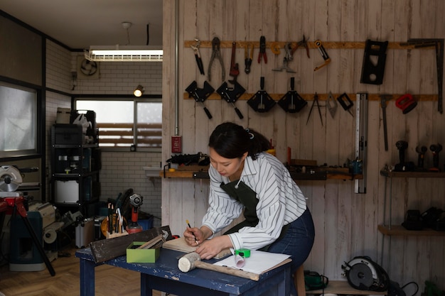 Free Photo woman measuring wood medium shot