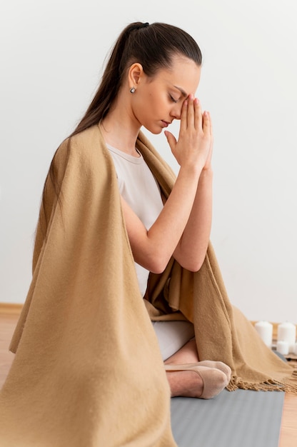 Woman meditating at home