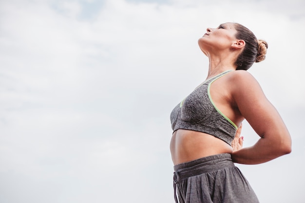 Free photo woman meditating looking to sky