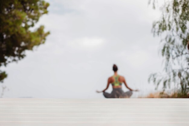 Woman meditating outdoors