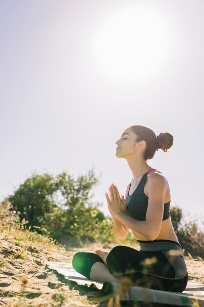 Woman meditating in the sun