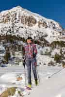 Free photo woman in the mountains practicing mountain skiing in the pyrenees of andorra