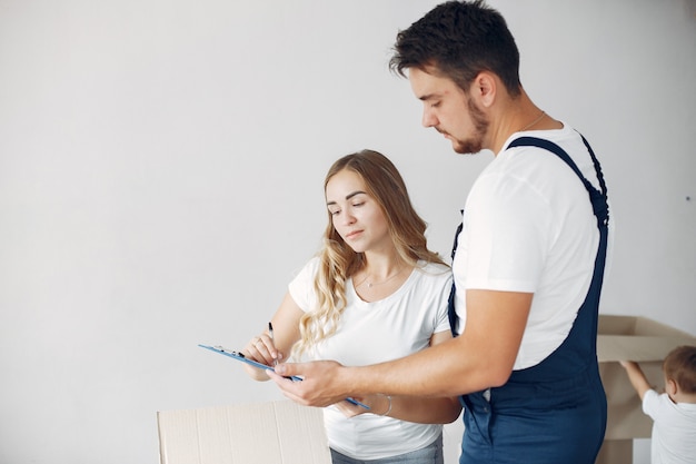 Woman moving, signing a paper