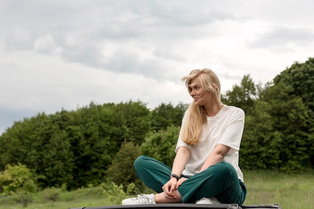 Free Photo woman in nature posing alluringly