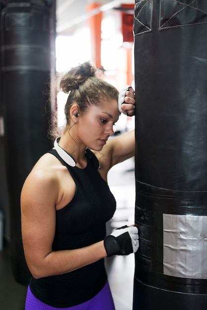 Woman near punching bag