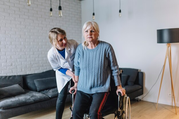 Woman in old age home with wheelchair