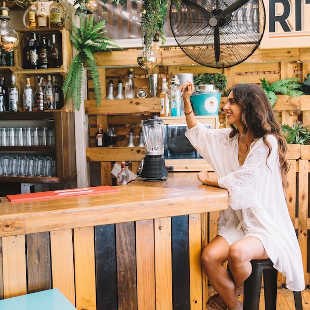 Woman ordering at bar