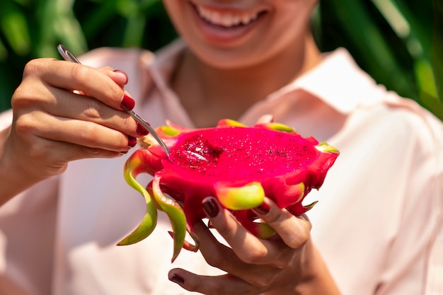 Free Photo woman outdoors with dragon fruit