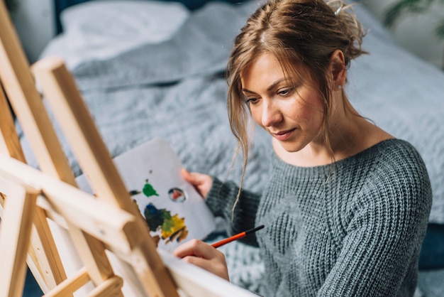 Woman painting at home