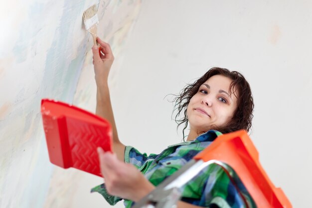 woman paints at home