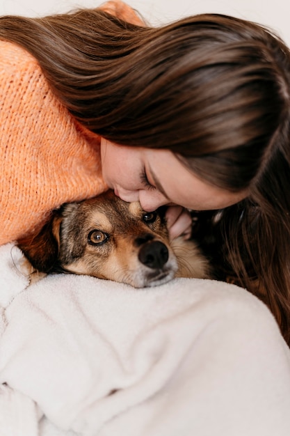 Free Photo woman petting adorable dog