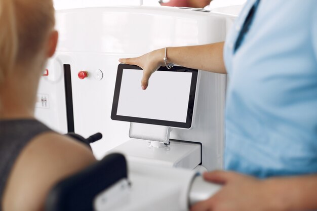 Woman at physiotherapy making physical exercises with qualified therapist